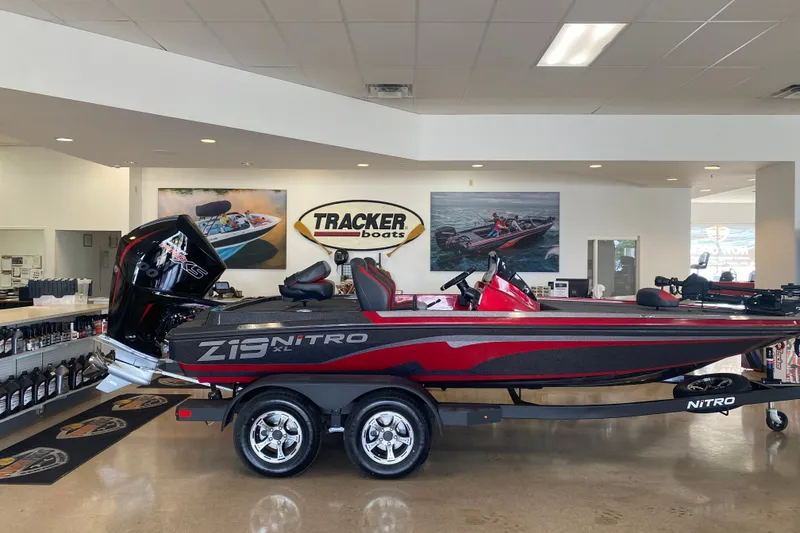 The Image of 2027 Nitro Z19 XL Pro boat displayed in showroom with Tracker Boats signage. - 0