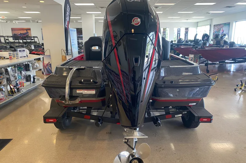 Slide: The Image of 2027 Nitro Z19 XL Pro boat displayed in a showroom, rear view with motor. - 8