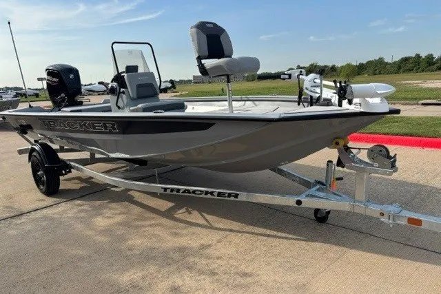 Slide: The Image of 2027 Tracker Bass Tracker 175 CC fishing boat on trailer, parked outdoors. - 14