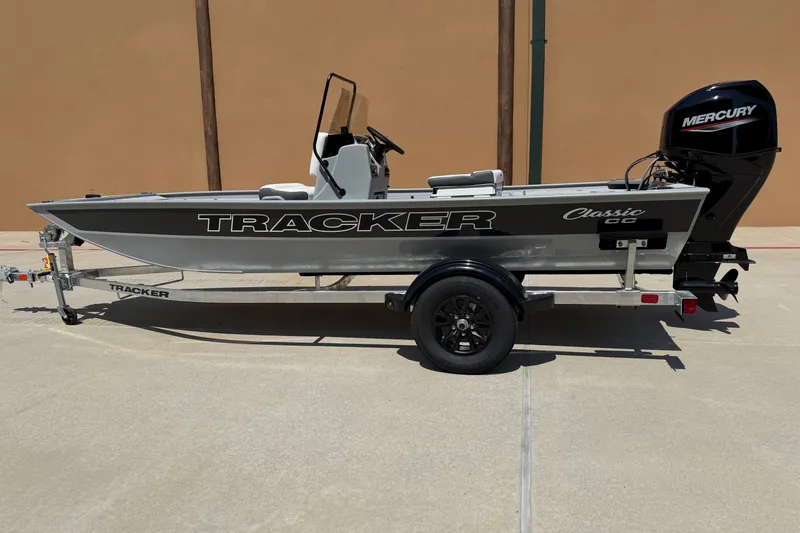 The Image of 2027 Tracker Bass Tracker Classic CC boat on trailer, side view, with Mercury engine. - 0