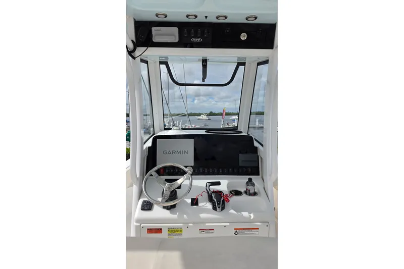 Slide: The Image of 2024 Sea Hunt Escape 25 boat dashboard with Garmin navigation system. - 10
