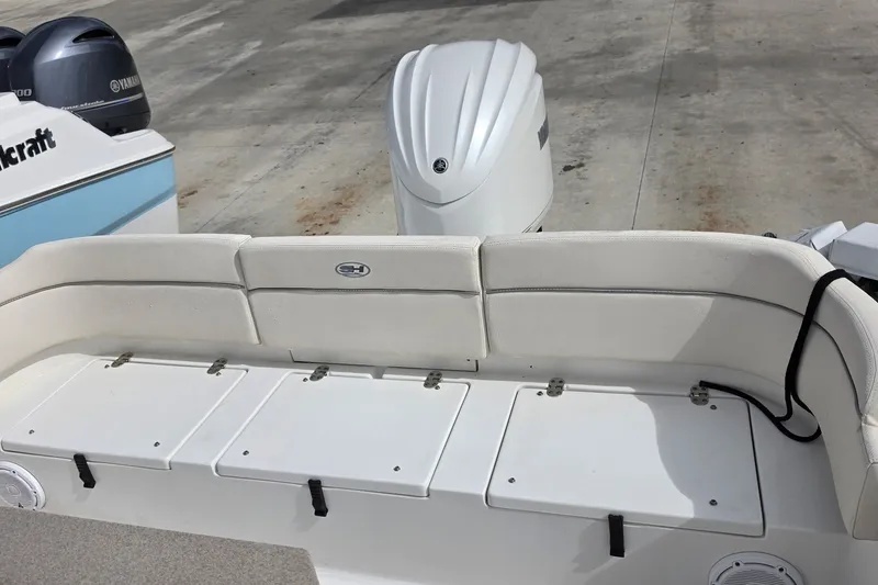 Slide: The Image of 2024 Sea Hunt Escape 25 boat with Yamaha outboard engines, featuring spacious seating and storage. - 4