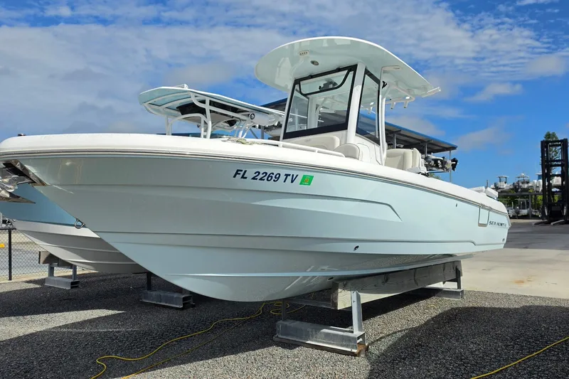 Slide: The Image of 2024 Sea Hunt Escape 25 boat on display, featuring sleek design and modern amenities. - 2