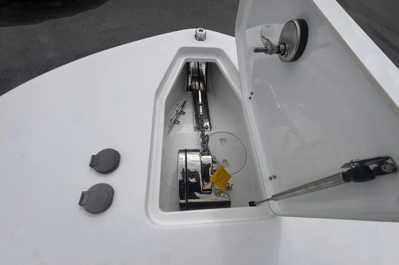 Slide: The Image of 2024 Sea Hunt Escape 25 anchor locker with chain and winch system. - 53