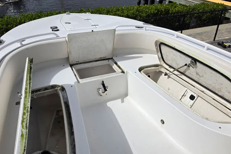 Slide: The Image of 2024 Sea Hunt Escape 25 boat interior with open storage compartments. - 5