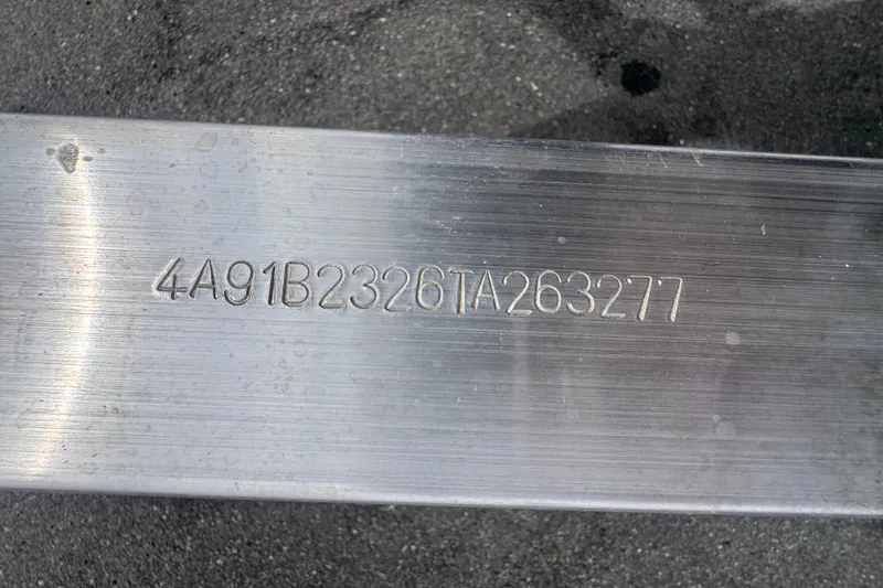 Slide: The Image of VIN on metal surface of 2024 Sea Hunt Escape 25 boat. - 76