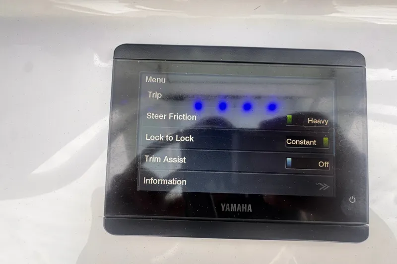Slide: The Image of Yamaha display on 2024 Sea Hunt Escape 25 boat showing steering and trim settings. - 29