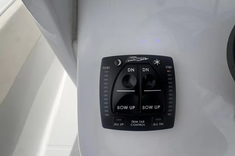 Slide: The Image of Bennett trim tab control panel on 2024 Sea Hunt Escape 25 boat. - 36