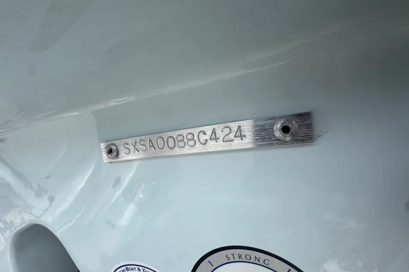 Slide: The Image of 2024 Sea Hunt Escape 25 hull identification number plate on boat exterior. - 75