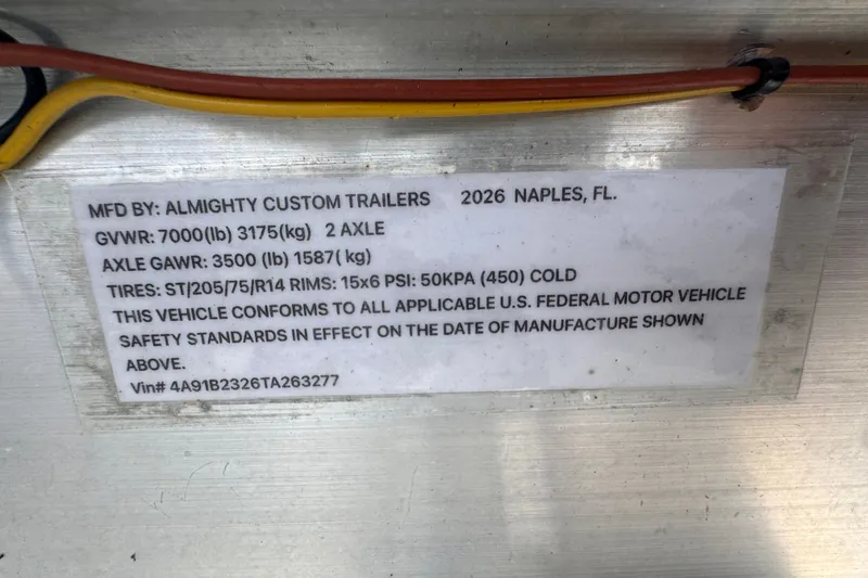 Slide: The Image of Label on trailer detailing specifications and compliance, manufactured by Almighty Custom Trailers, Naples, FL. - 74