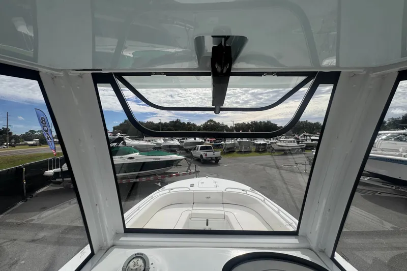 Slide: The Image of 2024 Sea Hunt Escape 25 boat interior view at a marina. - 41