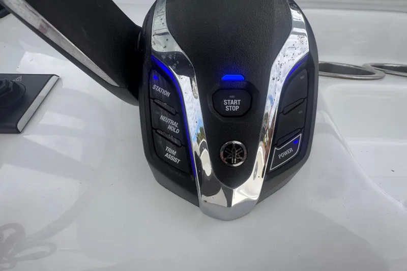Slide: The Image of Close-up of 2024 Sea Hunt Escape 25 boat control panel with start/stop button. - 35