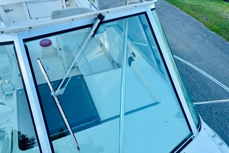 Slide: The Image of 2002 Pursuit 3000 Express boat windshield and cockpit view. - 69