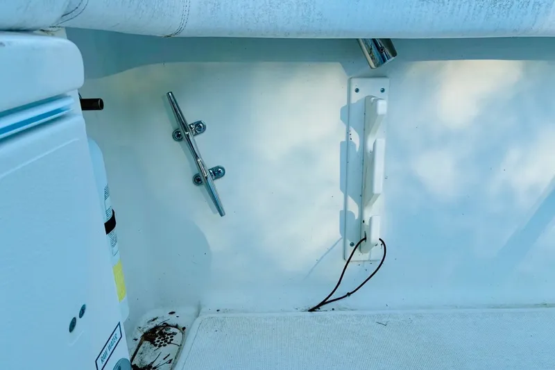 Slide: The Image of 2002 Pursuit 3000 Express boat interior with cleat and wiring details. - 75