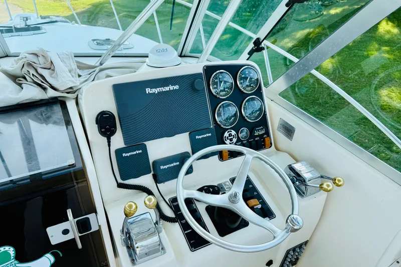 Slide: The Image of Helm of 2002 Pursuit 3000 Express boat with Raymarine navigation system and gauges. - 6