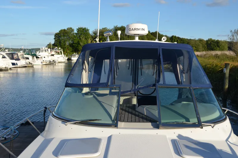 Slide: The Image of 2002 Formula 37 Performance Cruiser docked at marina, featuring Garmin navigation system. - 4