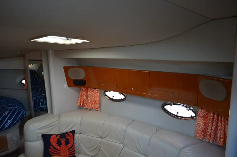 Slide: The Image of Interior of 2002 Formula 37 Performance Cruiser with leather seating and wooden cabinets. - 52