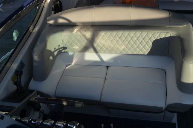 Slide: The Image of 2002 Formula 37 Performance Cruiser cockpit with plush seating and steering wheel. - 8