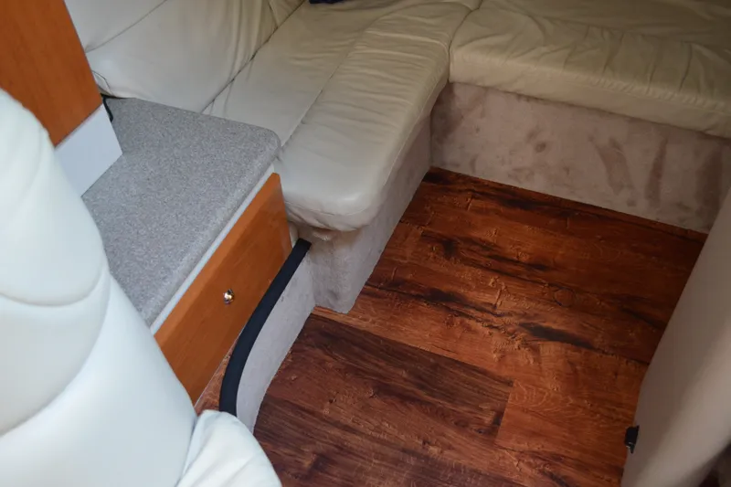 Slide: The Image of Interior of 2002 Formula 37 Performance Cruiser with wood flooring and beige seating. - 53