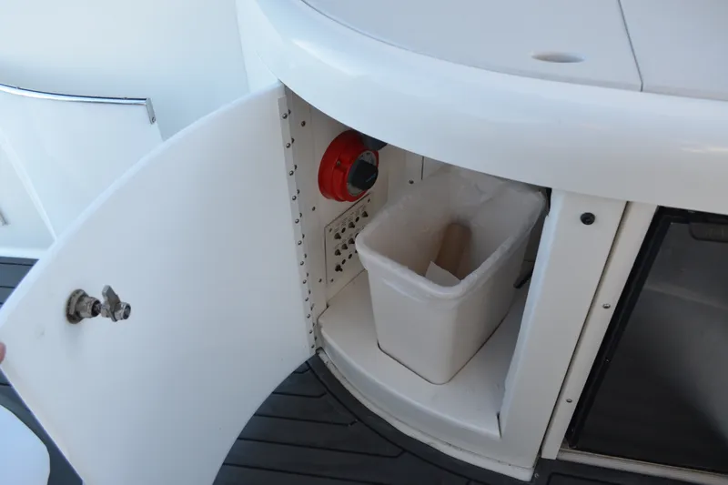 Slide: The Image of Cabinet with trash bin on 2002 Formula 37 Performance Cruiser boat. - 19