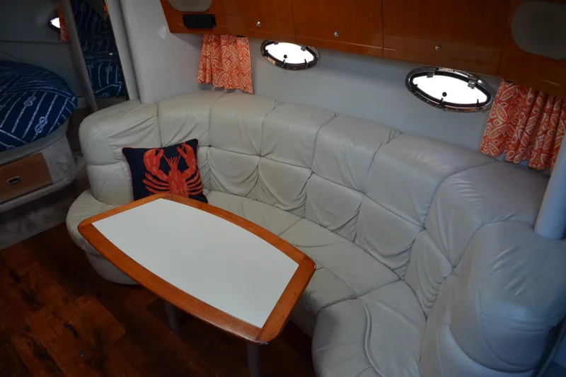 Slide: The Image of Interior of 2002 Formula 37 Performance Cruiser with white leather seating and nautical decor. - 43