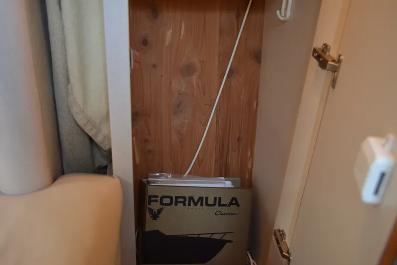 Slide: The Image of Cabinet interior with Formula 37 Performance Cruiser manual, 2002 model. - 56