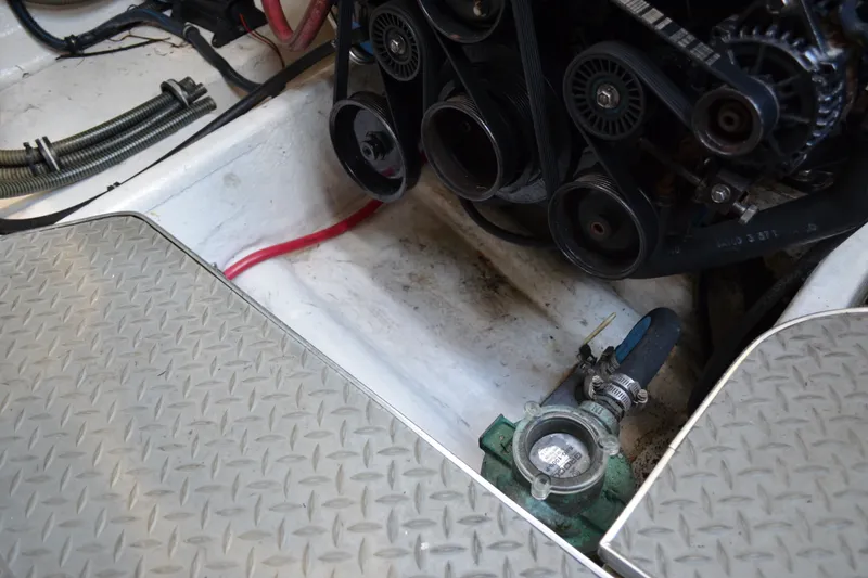 Slide: The Image of Engine compartment of a 2002 Formula 37 Performance Cruiser with visible belts and hoses. - 72