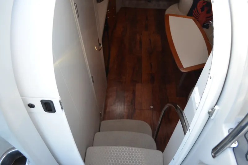 Slide: The Image of Interior view of 2002 Formula 37 Performance Cruiser with wooden flooring and seating area. - 33