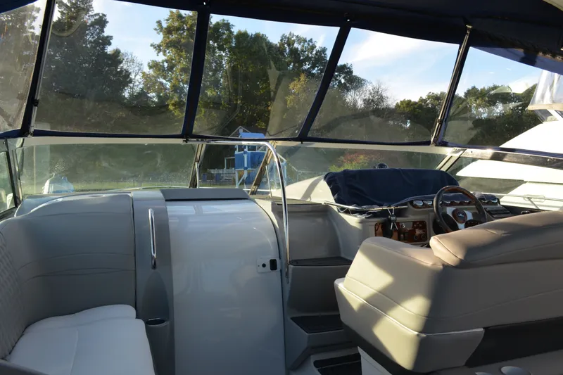 Slide: The Image of Interior view of a 2002 Formula 37 Performance Cruiser, featuring helm and seating area. - 32