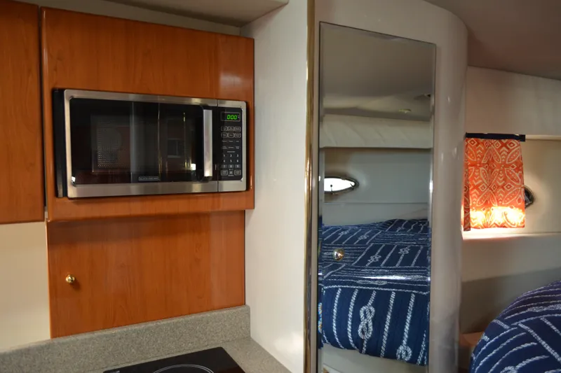 Slide: The Image of Interior of 2002 Formula 37 Performance Cruiser with microwave and cozy cabin. - 39