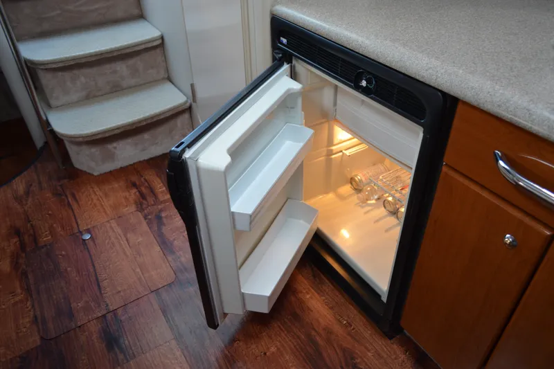 Slide: The Image of Open refrigerator in 2002 Formula 37 Performance Cruiser cabin interior. - 37