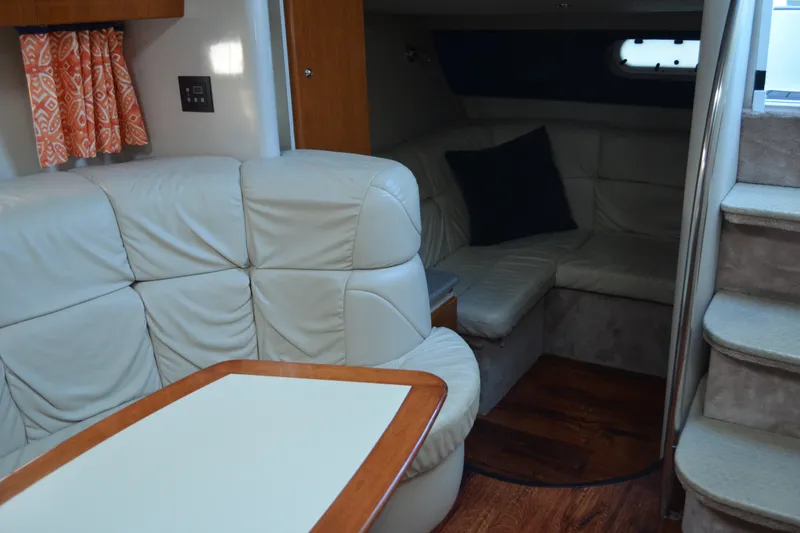 Slide: The Image of Interior of 2002 Formula 37 Performance Cruiser with leather seating and wooden table. - 44
