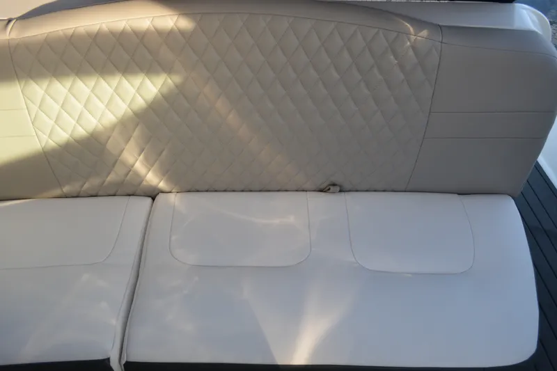 Slide: The Image of White leather seating on a 2002 Formula 37 Performance Cruiser boat. - 21