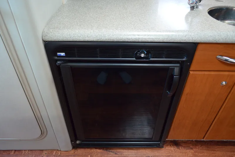 Slide: The Image of Compact refrigerator in 2002 Formula 37 Performance Cruiser kitchen area. - 36