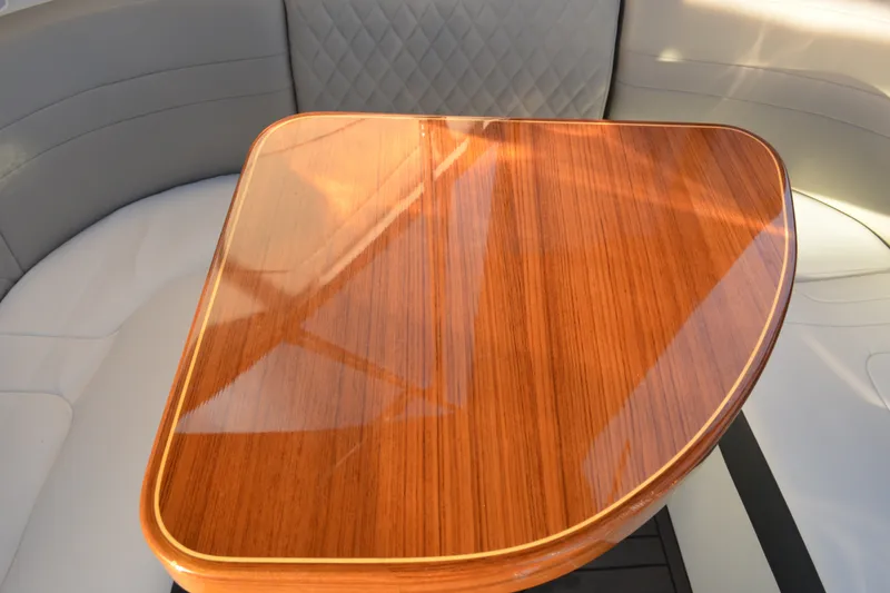 Slide: The Image of Polished wooden table on 2002 Formula 37 Performance Cruiser, surrounded by cushioned seating. - 20