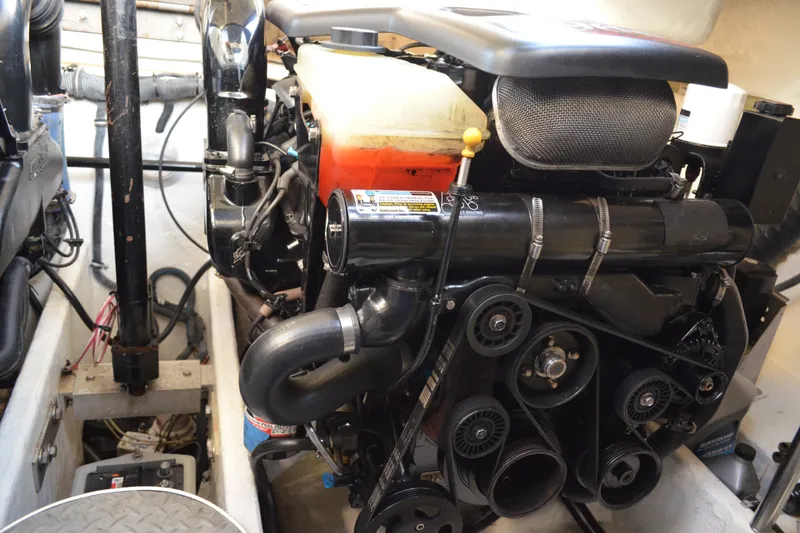 Slide: The Image of Engine compartment of a 2002 Formula 37 Performance Cruiser, showcasing mechanical components. - 70