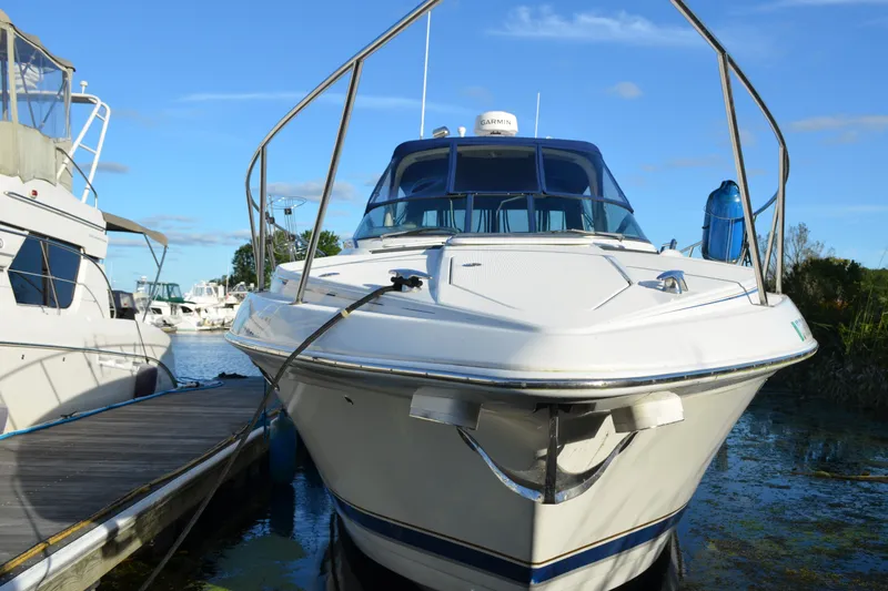 Slide: The Image of 2002 Formula 37 Performance Cruiser docked at marina under clear blue sky. - 3