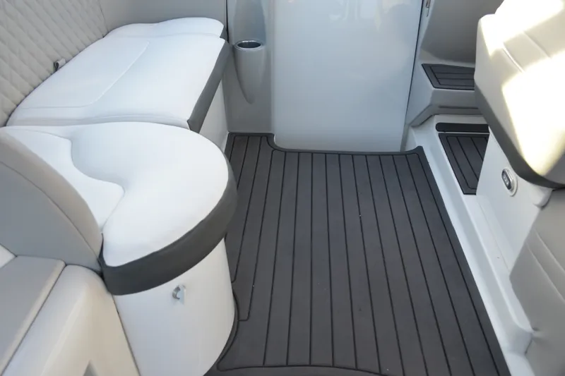 Slide: The Image of Interior seating of a 2002 Formula 37 Performance Cruiser with cushioned seats and sleek flooring. - 23