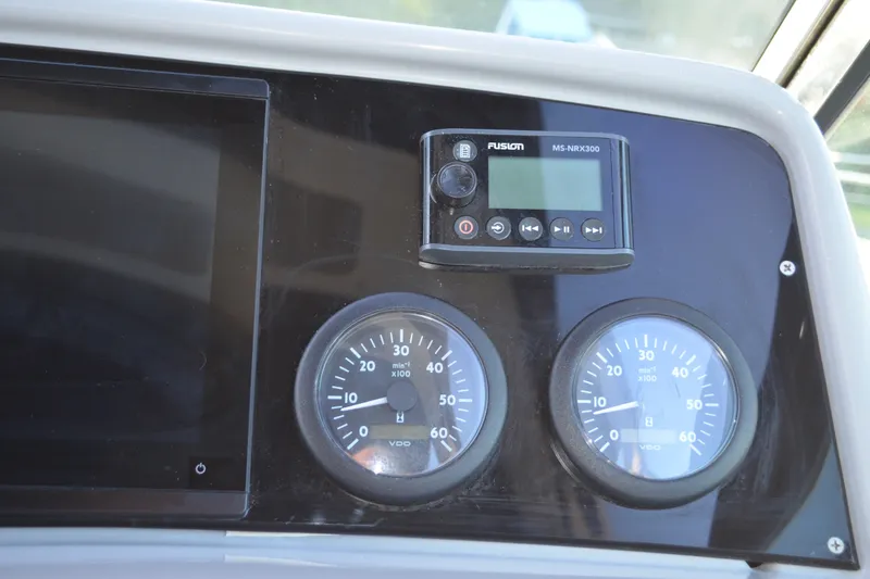 Slide: The Image of Dashboard of 2002 Formula 37 Performance Cruiser with gauges and Fusion MS-NRX300 unit. - 31