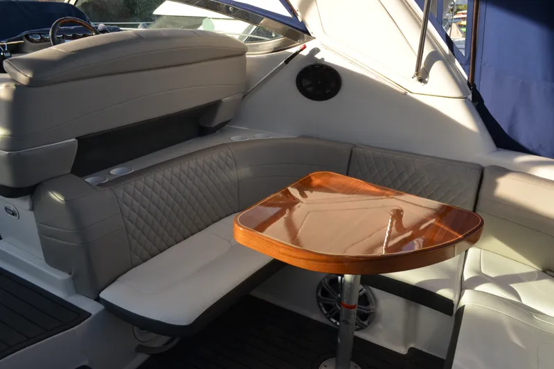 Slide: The Image of Interior of a 2002 Formula 37 Performance Cruiser with elegant seating and wooden table. - 13
