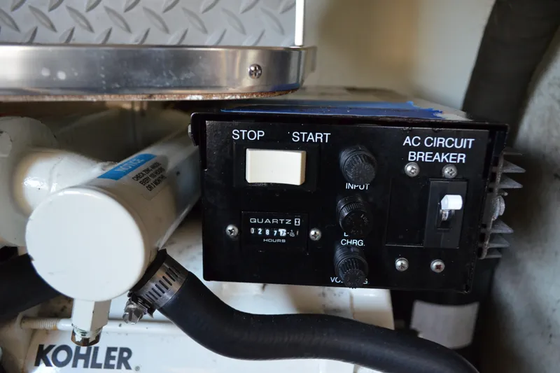 Slide: The Image of Control panel of a 2002 Formula 37 Performance Cruiser with AC circuit breaker and hour meter. - 76