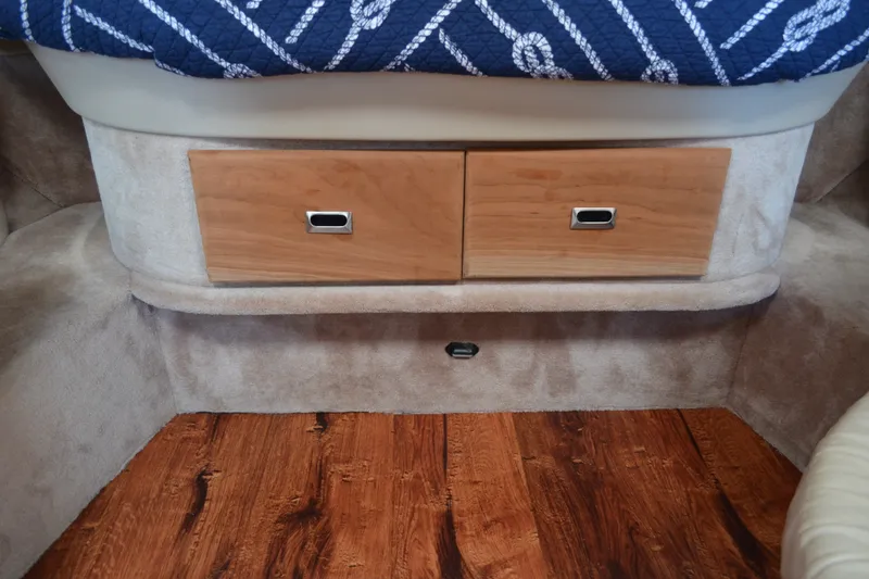 Slide: The Image of Interior of 2002 Formula 37 Performance Cruiser with wooden drawers and nautical-themed bedding. - 47
