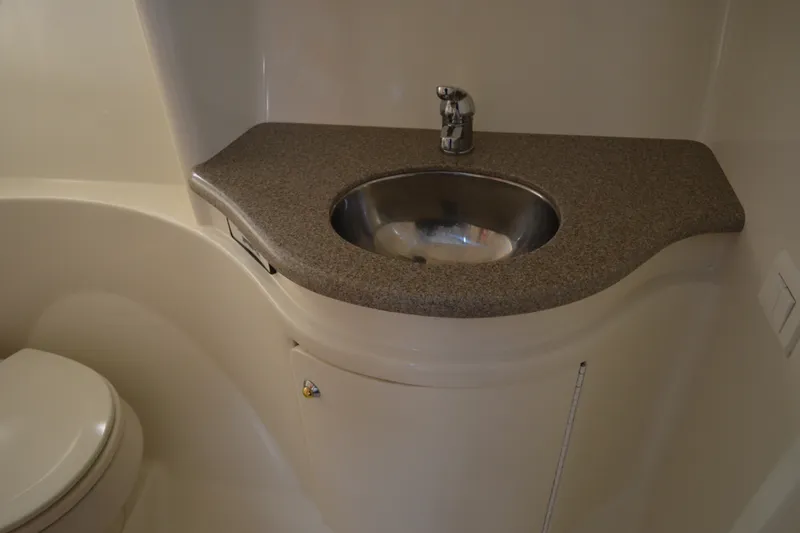 Slide: The Image of 2002 Formula 37 Performance Cruiser bathroom with sink and toilet. - 62