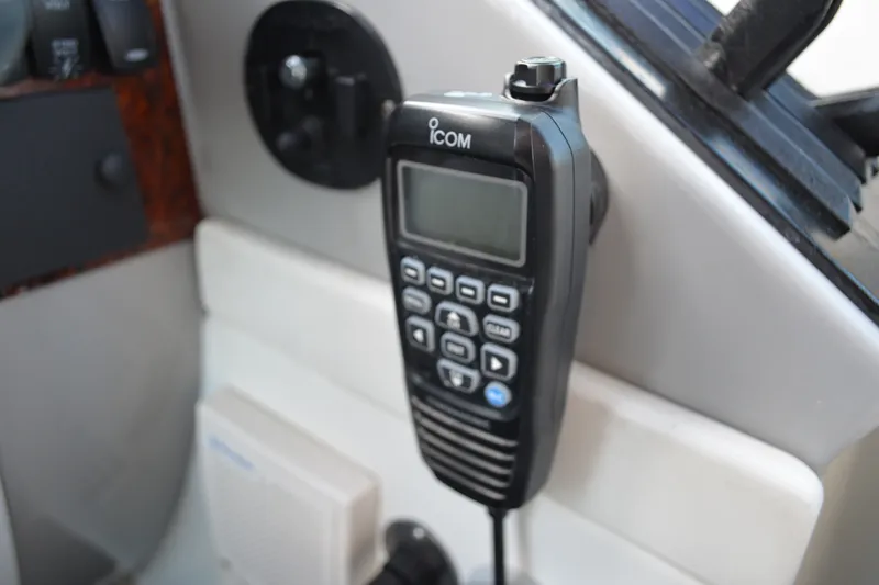 Slide: The Image of ICOM marine radio on 2002 Formula 37 Performance Cruiser dashboard. - 30