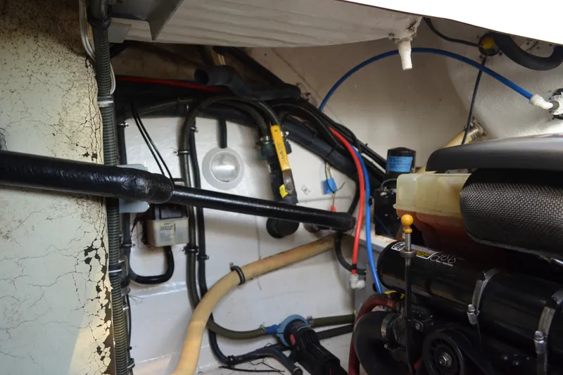 Slide: The Image of Engine compartment of a 2002 Formula 37 Performance Cruiser with visible hoses and components. - 73