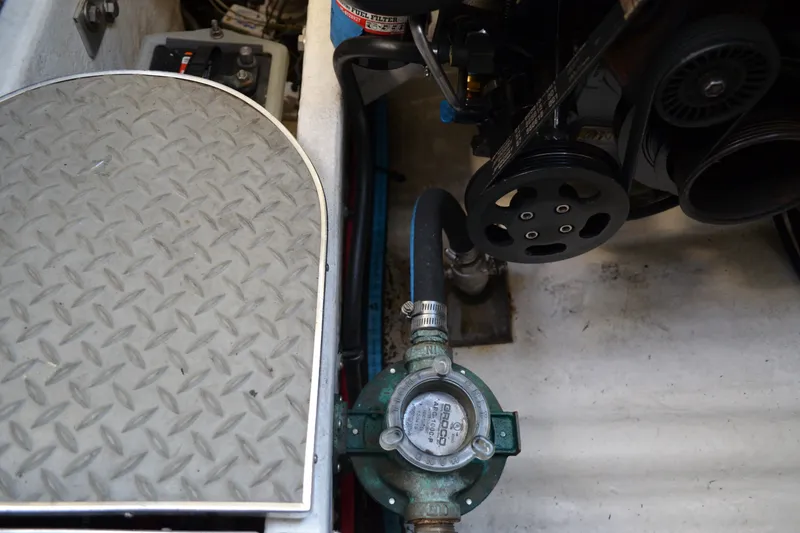 Slide: The Image of Engine compartment of a 2002 Formula 37 Performance Cruiser with visible components and piping. - 71
