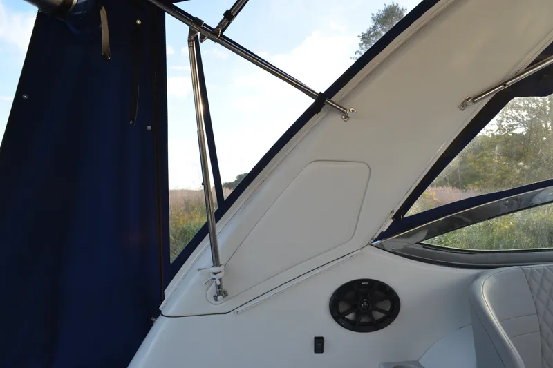 Slide: The Image of Interior view of a 2002 Formula 37 Performance Cruiser with blue canopy and speaker. - 18