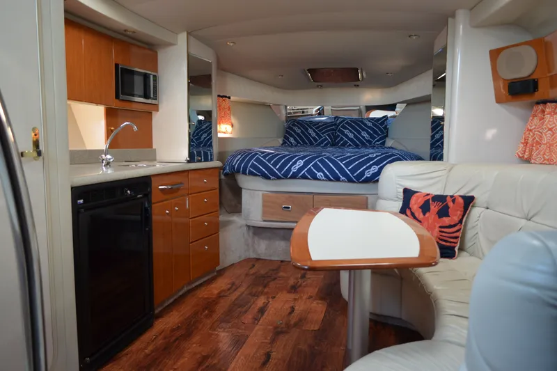 Slide: The Image of 2002 Formula 37 Performance Cruiser interior with kitchen, seating, and bed. - 42