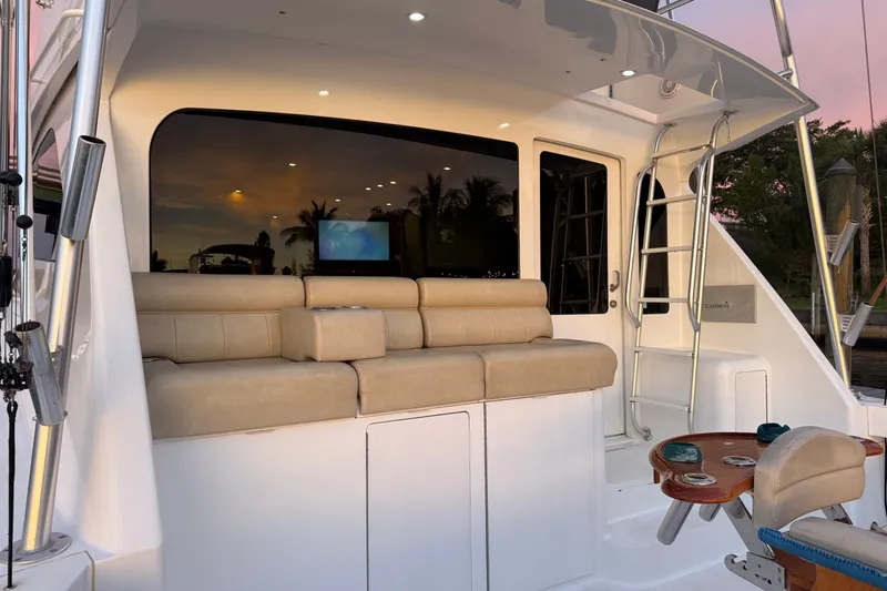 Slide: The Image of Luxurious 2002 Viking 52 Convertible yacht interior with beige seating and elegant design. - 4