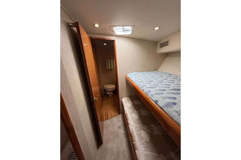 Slide: The Image of Interior of 2002 Viking 52 Convertible yacht with bunk beds and bathroom. - 39
